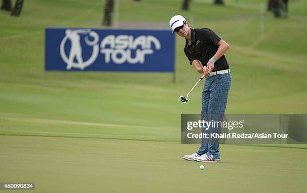 Quincy Quek of Singapore plays a shot during round four of the Indonesia Open at Damai Indah Golf, Pantai Indah Kapuk Course on December 7, 2014 in...