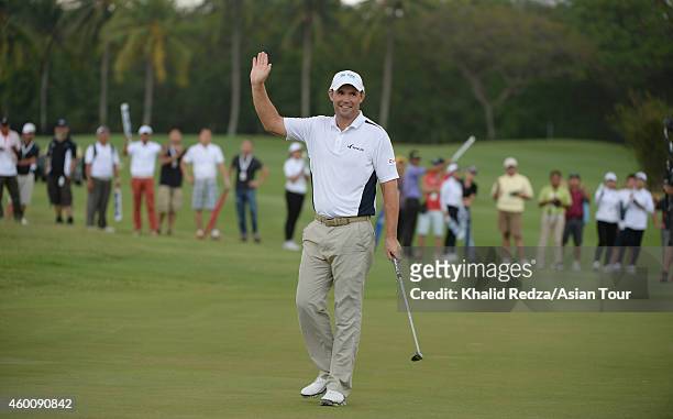 Padraig Harrington of Ireland waves to the gallery on the 18th green during round four of the Indonesia Open at Damai Indah Golf, Pantai Indah Kapuk...