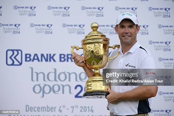 Padraig Harrington of Ireland poses with the trophy after winning during round four of the Indonesia Open at Damai Indah Golf, Pantai Indah Kapuk...