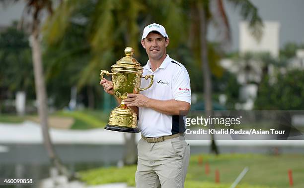 Padraig Harrington of Ireland poses with the trophy after winning during round four of the Indonesia Open at Damai Indah Golf, Pantai Indah Kapuk...
