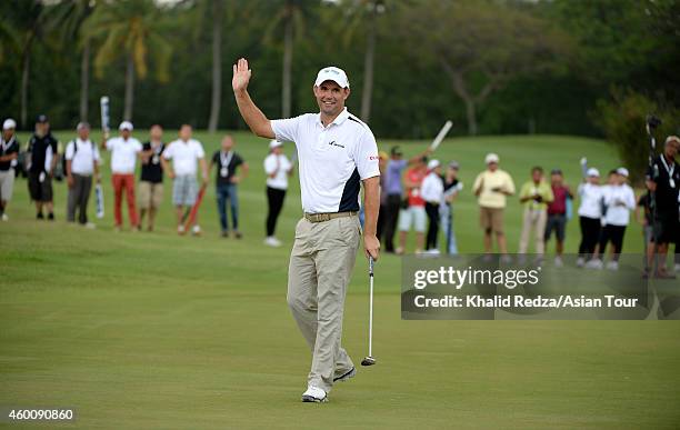 Padraig Harrington of Ireland waves to the gallery on the 18th green during round four of the Indonesia Open at Damai Indah Golf, Pantai Indah Kapuk...