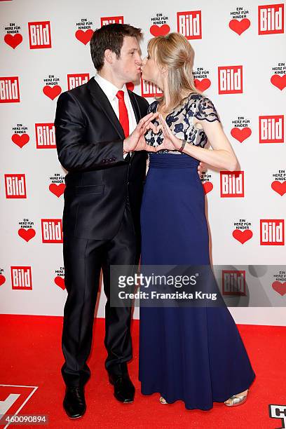 Matthias Steiner and Inge Steiner attend the Ein Herz Fuer Kinder Gala 2014 - Red Carpet Arrivals on December 6, 2014 in Berlin, Germany.
