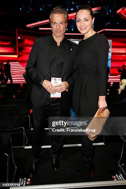 Hannes Jaenicke and Sarah Maria Besgen attend the Ein Herz Fuer Kinder Gala 2014 - Red Carpet Arrivals on December 6, 2014 in Berlin, Germany.