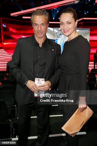 Hannes Jaenicke and Sarah Maria Besgen attend the Ein Herz Fuer Kinder Gala 2014 - Red Carpet Arrivals on December 6, 2014 in Berlin, Germany.