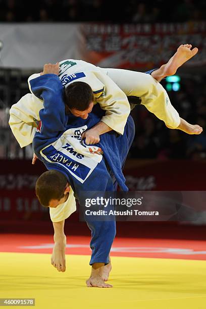 Artem Bloshenko of Ukrain and Martin Pacek of Sweden compete in Men's -100kg Bronze medal match during Judo Grand Slam Tokyo 2014 at Tokyo...