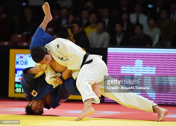 Jae Yun Kim of Korea and Kenta Nagasawa of Japan compete in Men's -90kg Bronze medal match during Judo Grand Slam Tokyo 2014 at Tokyo Metropolitan...