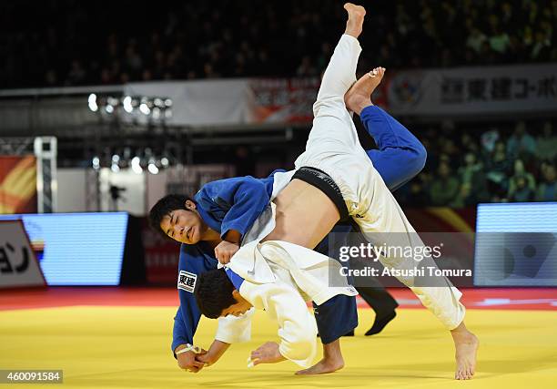 Jae Yun Kim of Korea and Kenta Nagasawa of Japan compete in Men's -90kg Bronze medal match during Judo Grand Slam Tokyo 2014 at Tokyo Metropolitan...