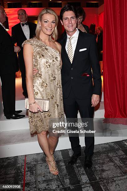 Maria Hoefl-Riesch and her husband Marcus Hoefl arrive at the Ein Herz fuer Kinder Gala 2014 at Tempelhof Airport on December 6, 2014 in Berlin,...