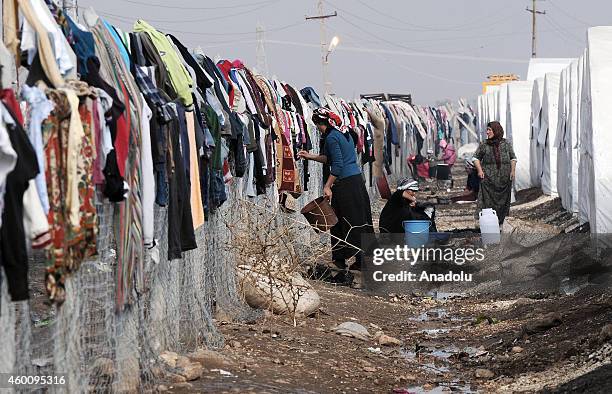 Syrians fled from the clashes between Islamic State of Iraq and the Levant and Syrian Kurdish armed groups in Kobani city, try to hold on life under...