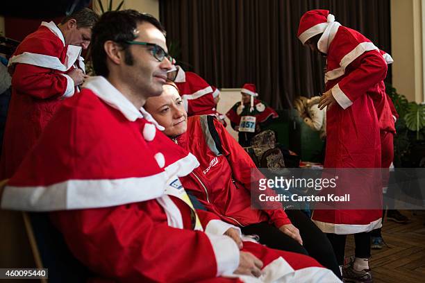Participants dressed as Santa Claus prepare to attend the annual Santa Run on December 7, 2014 in Michendorf, Germany. At least 800 adults and...