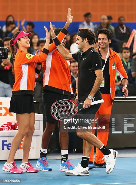 Roger Federer of the Indian Aces cogratulated by his team mate Ana Ivanovic after his victory in his match against Tomas Berdych of the Singapore...