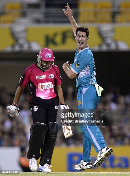 Ben Cutting of the Heat takes the wicket of Ravinder Bopara of the Sixers during the Big Bash League match between Brisbane Heat and the Sydney...