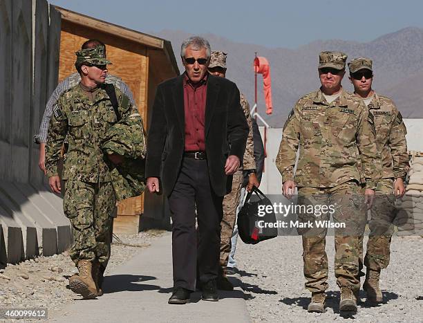 Secretary of Defense Chuck Hagel walks to meet with American troops during a visit, December 7, 2014 in FOB Gamberi, Afghanistan. Secretary Hagel...