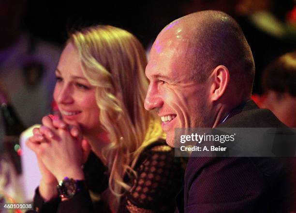 Arjen Robben and his wife Bernadien Robben attend the FC Bayern Muenchen christmas party at Schuhbeck's Teatro restaurant on December 7, 2014 in...