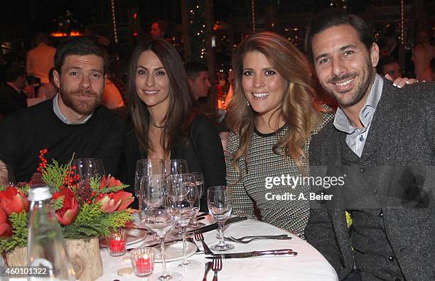 Xabi Alonso , his wife Nagore Aramburu and Claudio Pizarro and his wife Karla Salcedo attend the FC Bayern Muenchen Christmas Party at Schuhbeck's...