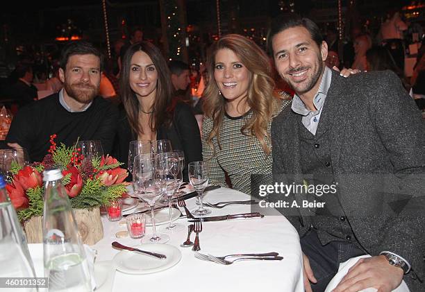 Xabi Alonso , his wife Nagore Aramburu and Claudio Pizarro and his wife Karla Salcedo attend the FC Bayern Muenchen Christmas Party at Schuhbeck's...