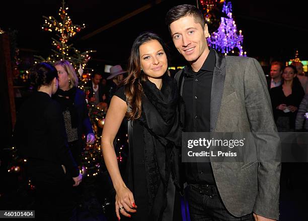 Robert Lewandowski and his wife Anna Stachurska attend the FC Bayern Muenchen Christmas Party at Schubeck's Teatro restaurant on December 7, 2014 in...