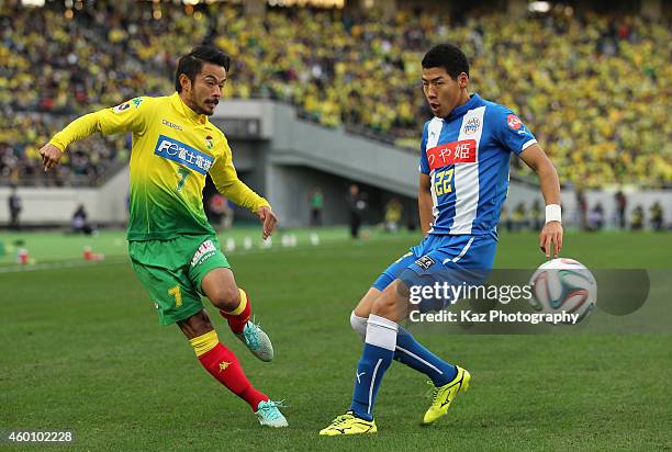 Yuto Sato of JEF United Chiba and Kim Byeom-Yong of Montedio Yamagata compete for the ball during the J1 Promotion Play-Off Final match between JEF...