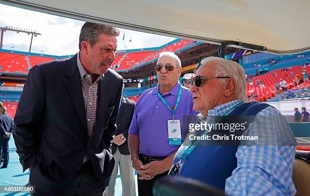 Former Miami Dolphins quarterback Dan Marino, left, speaks with former Dolphins head coach Don Shula, right, on the sideline before the Dolphins met...