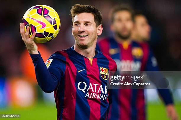 Lionel Messi of FC Barcelona with the match ball after scoring three goals during the La Liga match between FC Barcelona and RCD Espanyol at Camp Nou...