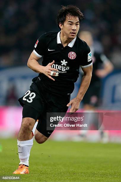 Shinji Okazaki of Mainz in action during the First Bundesliga match between Hamburger SV and 1. FSV Mainz 05 at Imtech Arena on December 7, 2014 in...