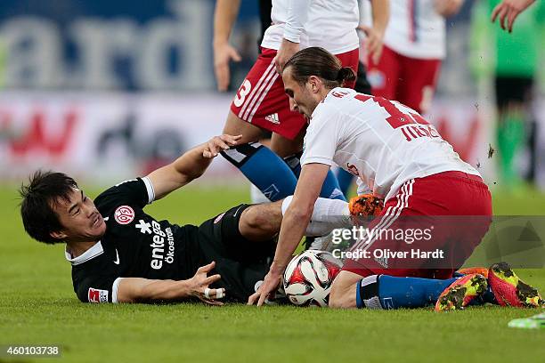 Petr Jiracek of Hamburg and Shinji Okazaki of Mainz compete during the First Bundesliga match between Hamburger SV and 1. FSV Mainz 05 at Imtech...