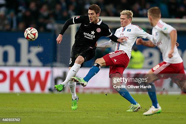 Artjoms Rudnevs of Hamburg and Stefan Bell of Mainz compete during the First Bundesliga match between Hamburger SV and 1. FSV Mainz 05 at Imtech...