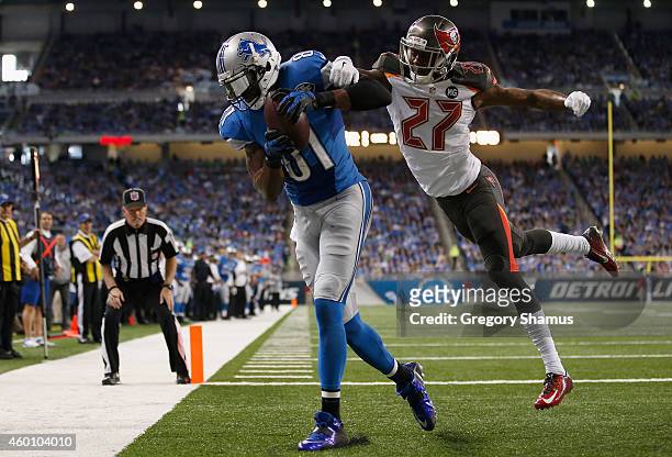 Calvin Johnson of the Detroit Lions catches a first quarter touchdown in front of Johnthan Banks of the Tampa Bay Buccaneers at Ford Field on...