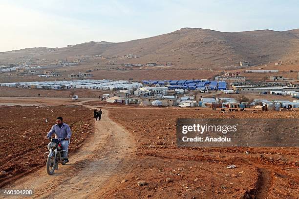 View of Babel refugee camp in eastern Lebanese city of Arsal where Syrian refugees fled their homes due to the civil war in their country try to hold...