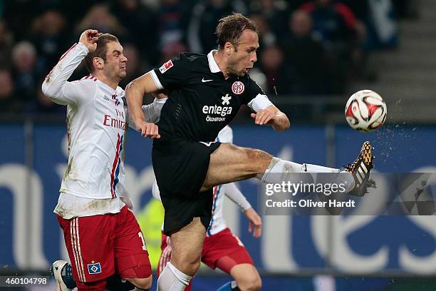 Pierre Michel Lasogga of Hamburg and Nikolce Noveski of Mainz compete during the First Bundesliga match between Hamburger SV and 1. FSV Mainz 05 at...