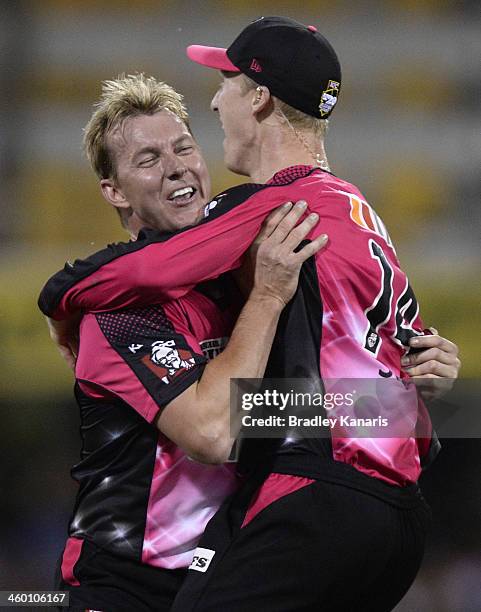 Brett Lee and Jordan Silk of the Sixers celebrate after Jordan Silk takes a spectacular catch to dismiss Craig Kieswetter of the Heat during the Big...