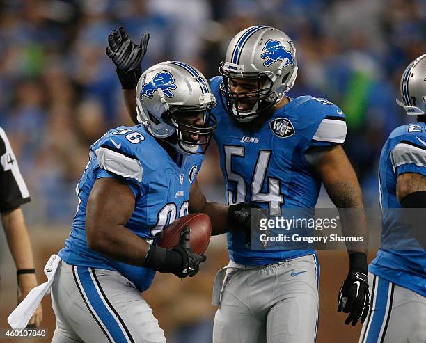 Andre Fluellen and DeAndre Levy of the Detroit Lions reacts to a second quarter fumble while playing the Tampa Bay Buccaneers at Ford Field on...