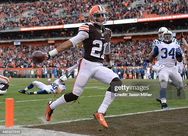 Justin Gilbert of the Cleveland Browns returns an interception for a touchdown during the third quarter against the Indianapolis Colts at FirstEnergy...