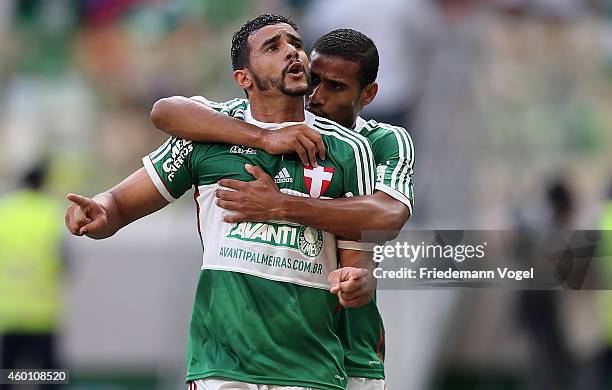 Henrique of Palmeiras celebrates scoring the first goal with Mazinho during the match between Palmeiras and Atletico PR for the Brazilian Series A...