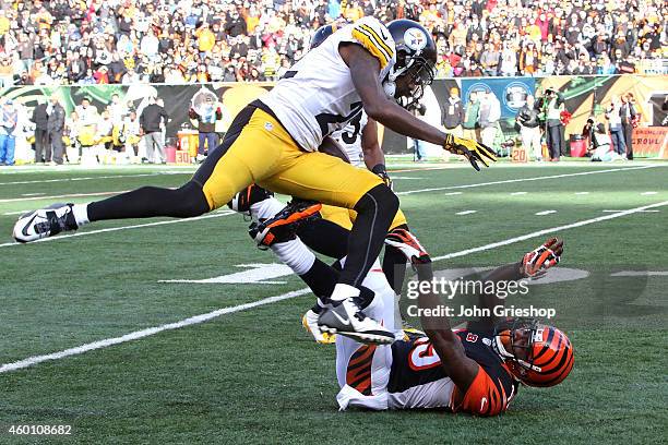 William Gay of the Pittsburgh Steelers jumps over Brandon Tate of the Cincinnati Bengals after intercepting a pass during the second quarter at Paul...