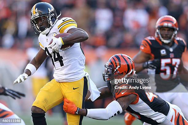 George Iloka of the Cincinnati Bengals attempts to tackle Antonio Brown of the Pittsburgh Steelers during the third quarter at Paul Brown Stadium on...