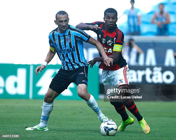 Hernan Barcos of Gremio battles for the ball against Marcelo of Flamengo during the match Gremio v Flamengo as part of Brasileirao Series A 2014, at...