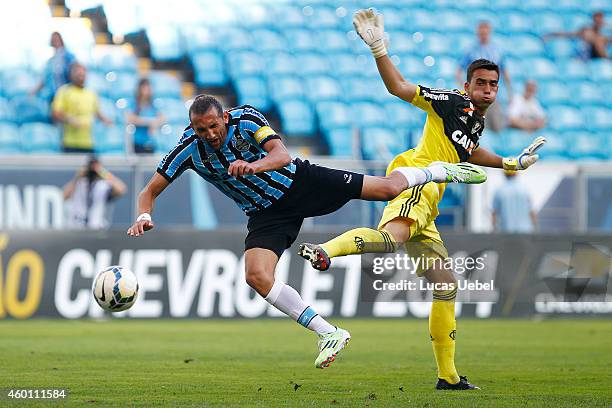 Hernan Barcos of Gremio battles for the ball against Cesar of Flamengo during the match Gremio v Flamengo as part of Brasileirao Series A 2014, at...