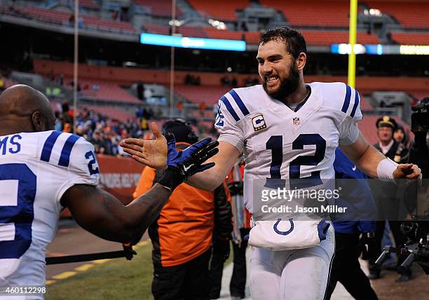 Andrew Luck celebrates with Mike Adams of the Indianapolis Colts after a 25-24 win over the Cleveland Browns at FirstEnergy Stadium on December 7,...