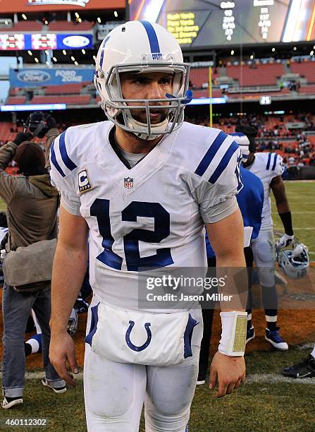 Andrew Luck of the Indianapolis Colts walks off the field after a 25-24 win over the Cleveland Browns at FirstEnergy Stadium on December 7, 2014 in...