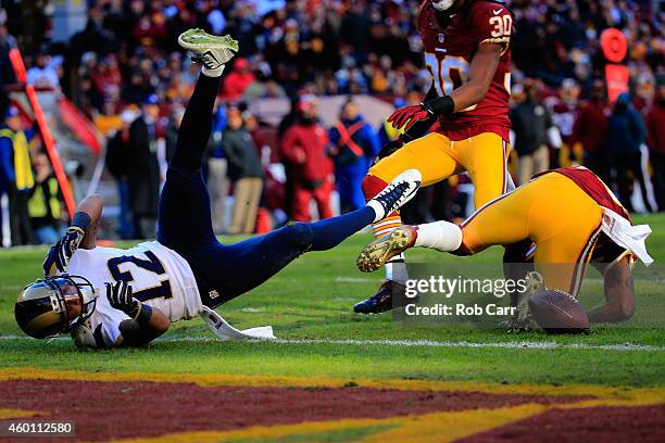 Wide receiver Stedman Bailey of the St. Louis Rams is tackled short of the endzone after making a second half catch against the Washington Redskins...