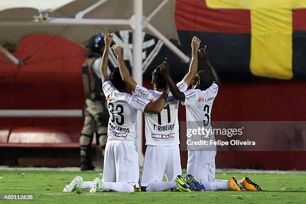 Thiago Ribeiro of Santos is mobbled by his team mates after scoring their goal against Vitoria during the match between Vitoria and Santos as part of...