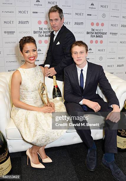 Gugu Mbatha-Raw, winner of the Best Actress award for "Belle", and presenters Tom Hollander and George Mackay pose at The Moet British Independent...