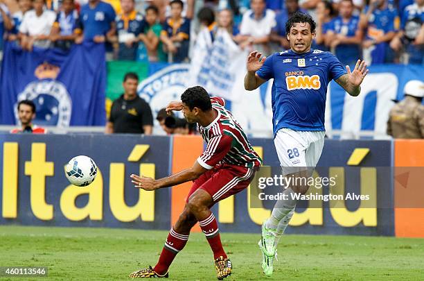 Ricardo Goulart of Cruzeiro struggles for the ball with Wagner of Fluminense during a match between Cruzeiro and Fluminense as part of Brasileirao...