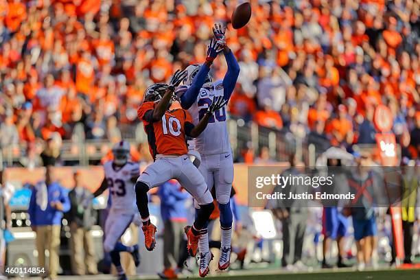 Cornerback Corey Graham of the Buffalo Bills intercepts a pass intended for wide receiver Emmanuel Sanders of the Denver Broncos during the second...