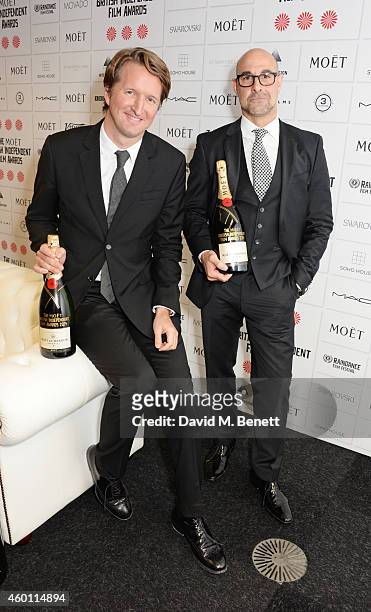 Presenters Tom Hooper and Stanley Tucci pose at The Moet British Independent Film Awards 2014 at Old Billingsgate Market on December 7, 2014 in...