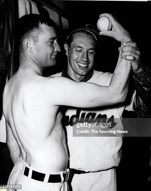 Bob Feller of the Cleveland Indians looks at the new $50,000 pitching arm of Bob Lemon circa 1953.