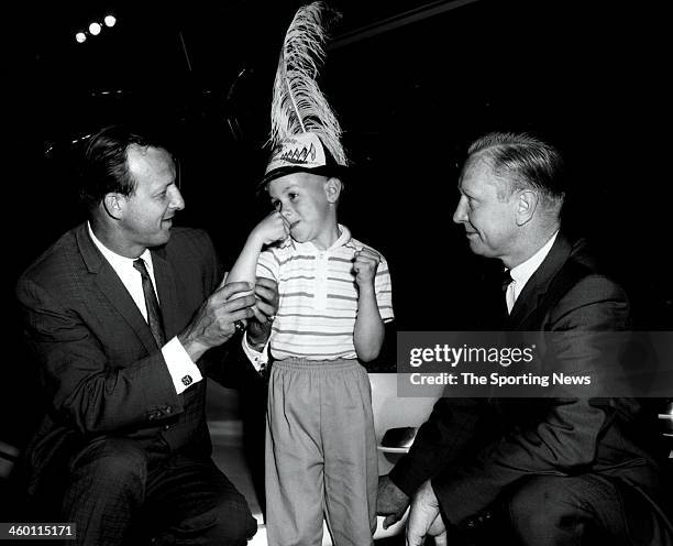 Stan Musial , one of baseball's all-time greats and now Director of the President's Council on Physical Fitness, makes a spot-check of Ronnie...