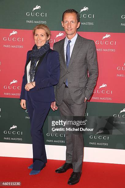 Marie Claire Daveu and Robert Triefus attend the Gucci Paris Master Day 4 on December 7, 2014 in Villepinte, France.