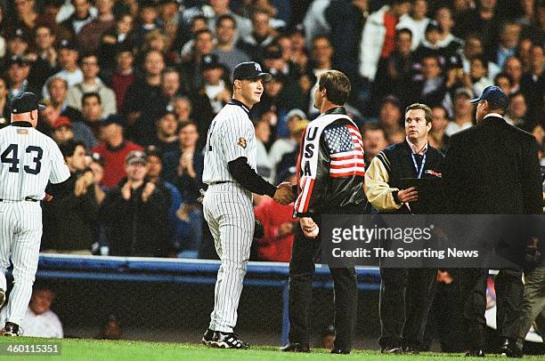 Don Mattingly shakes hands with Todd Greene of the New York Yankees after throwing out the first pitch prior to Game Five of the World Series against...